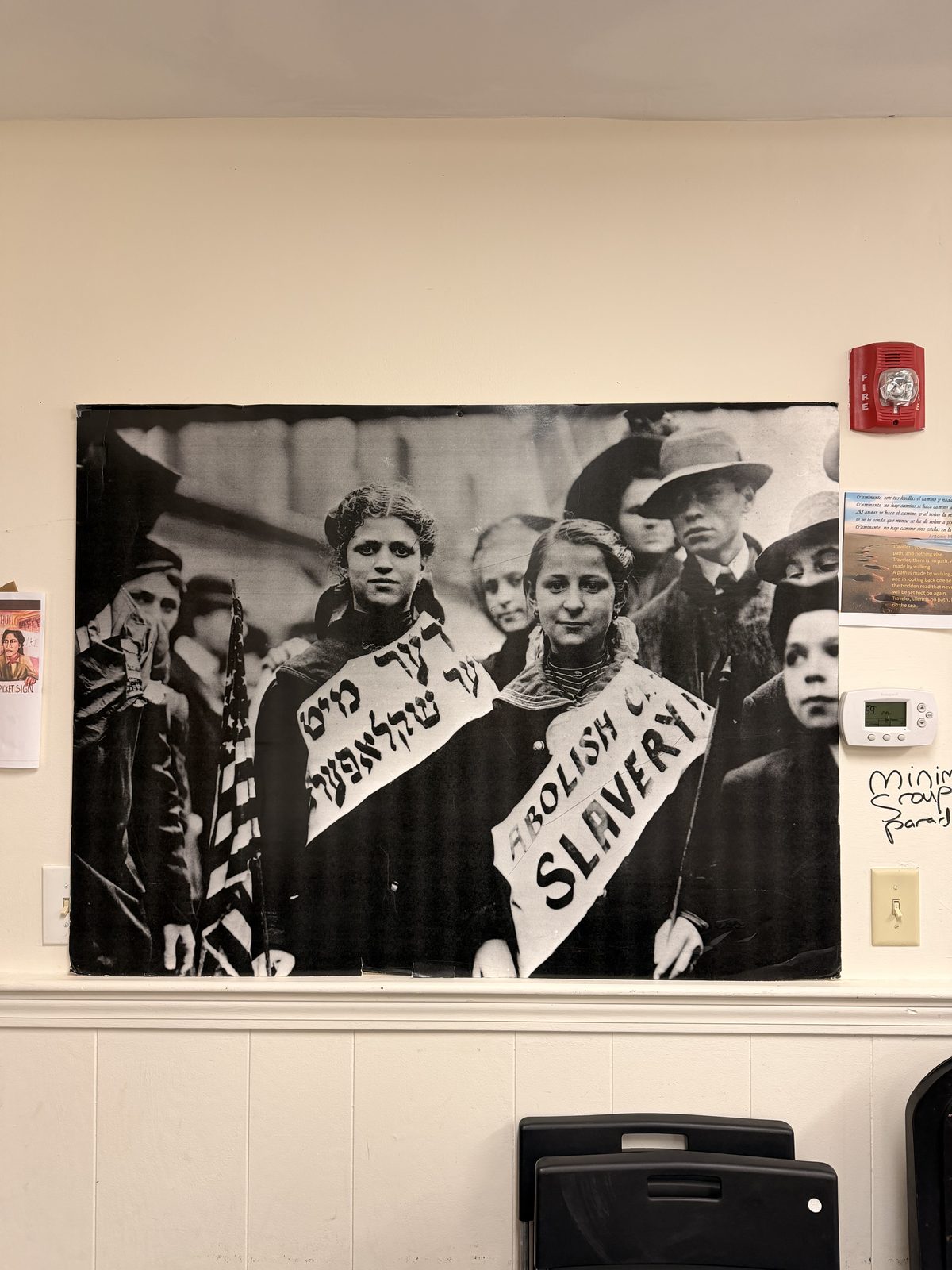 A historic photograph of immigrant women and abolitionist organizers displayed in the office
