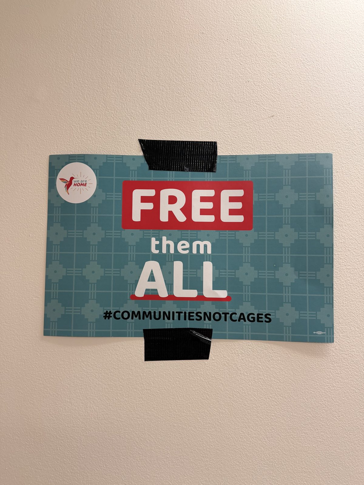 A Free Them All community advocacy poster inside TRII